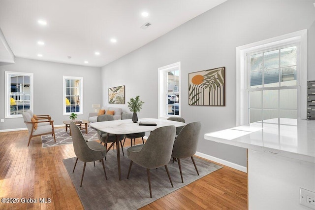 dining area with hardwood / wood-style floors