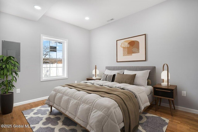 bedroom with hardwood / wood-style floors