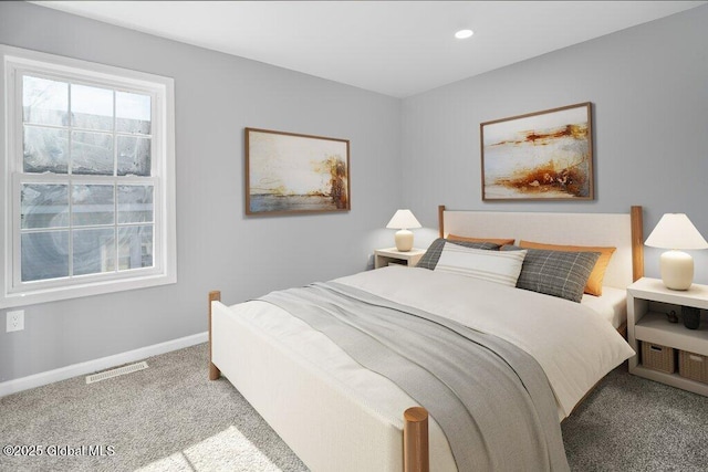 bedroom featuring light colored carpet