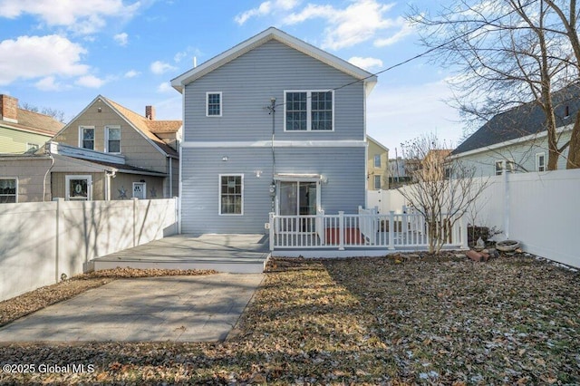 back of house with a patio and a deck