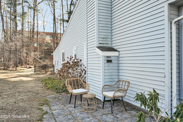 view of property exterior with a patio