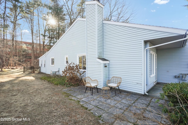 rear view of property with a patio area