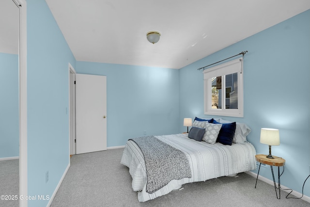 bedroom featuring light colored carpet