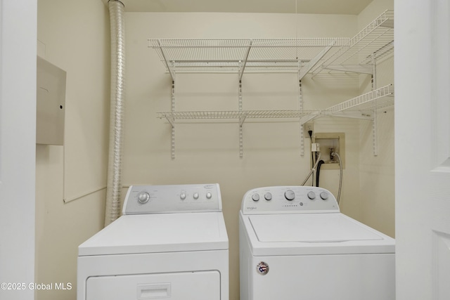 laundry room featuring separate washer and dryer