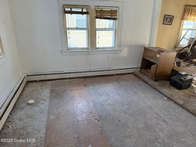 empty room featuring baseboard heating