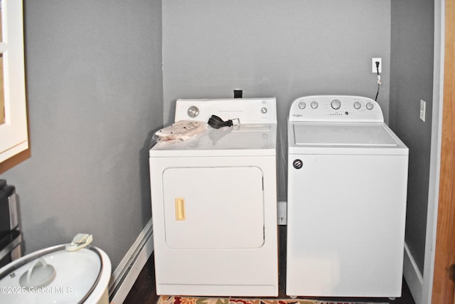 laundry area featuring a baseboard heating unit and washing machine and clothes dryer