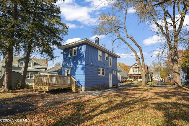 view of side of property featuring a deck