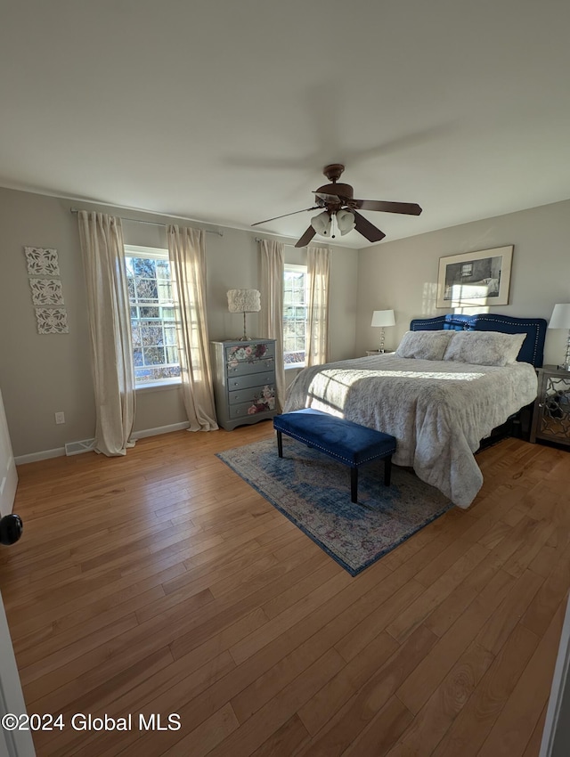 bedroom featuring ceiling fan and hardwood / wood-style flooring