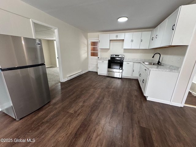 kitchen with a baseboard heating unit, stainless steel appliances, a sink, white cabinetry, and light countertops