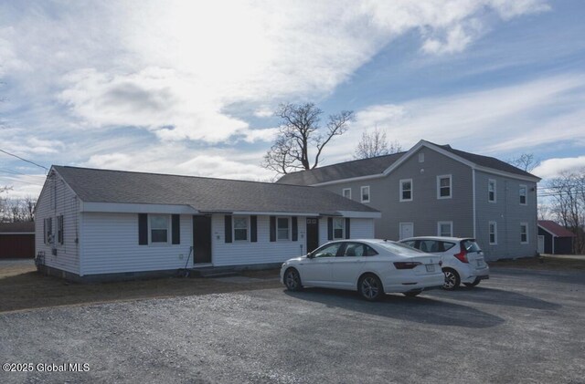 view of front of house featuring a shingled roof