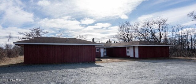 view of side of home featuring an outdoor structure