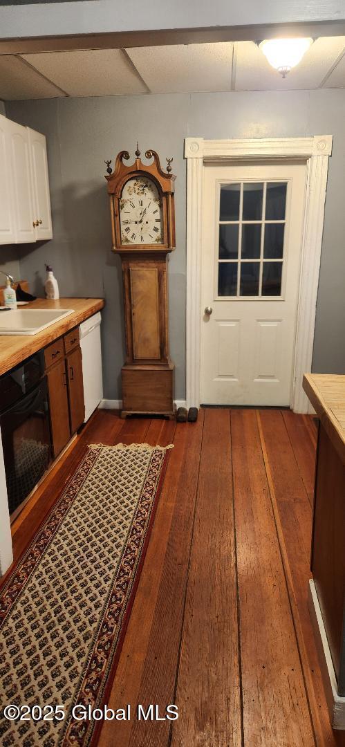 interior space featuring dark hardwood / wood-style flooring and sink