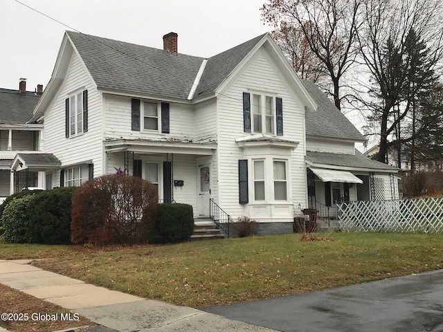24 4th Ave, Gloversville, NY 12078 - view of front of home with a front yard