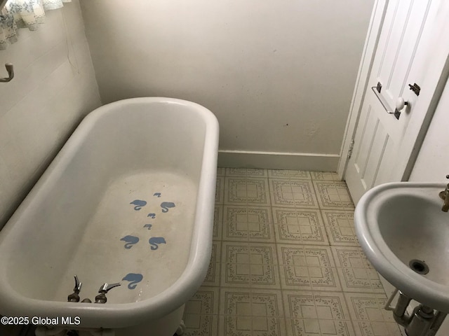 24 4th Ave, Gloversville, NY 12078 - bathroom featuring a tub to relax in and sink