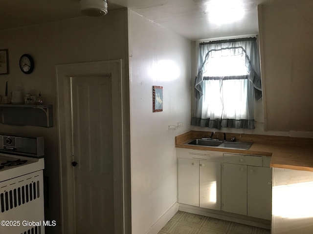 24 4th Ave, Gloversville, NY 12078 - kitchen featuring sink and range