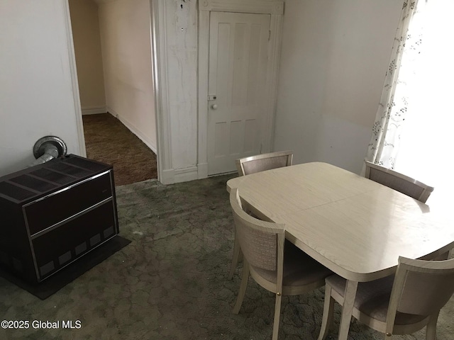 24 4th Ave, Gloversville, NY 12078 - dining room featuring heating unit and dark colored carpet