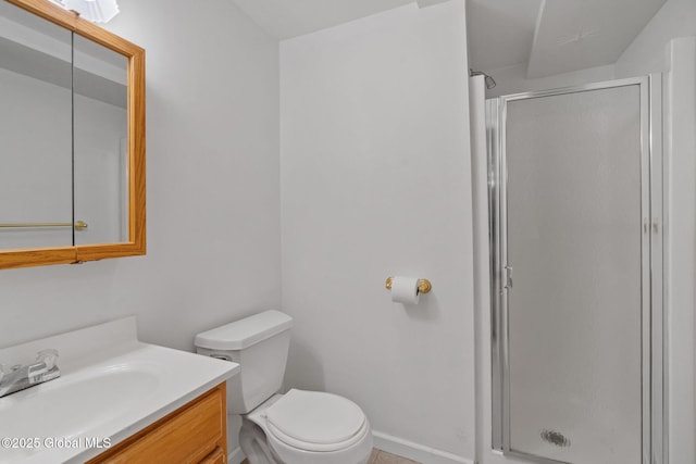 bathroom with a shower with door, toilet, and vanity