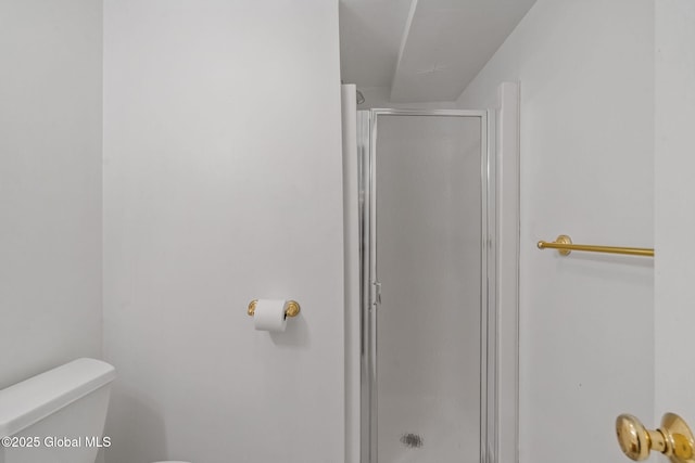 bathroom with toilet and walk in shower