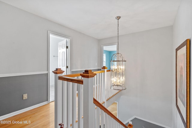 interior space featuring light wood-type flooring and a chandelier