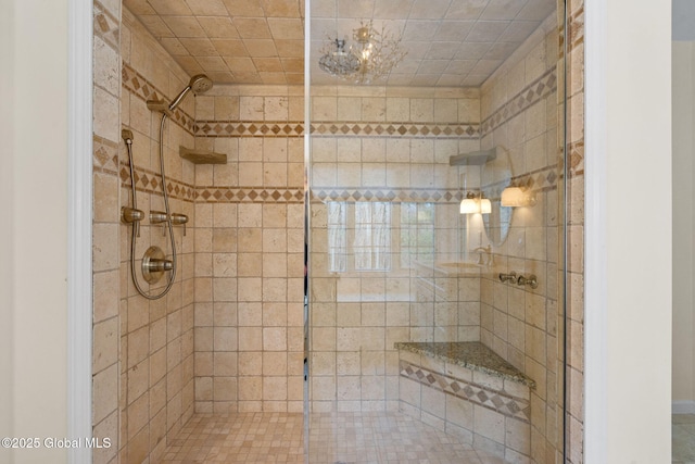 bathroom with a tile shower