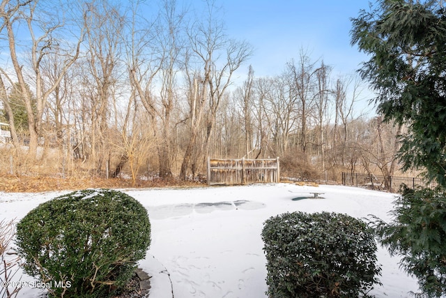 view of yard layered in snow