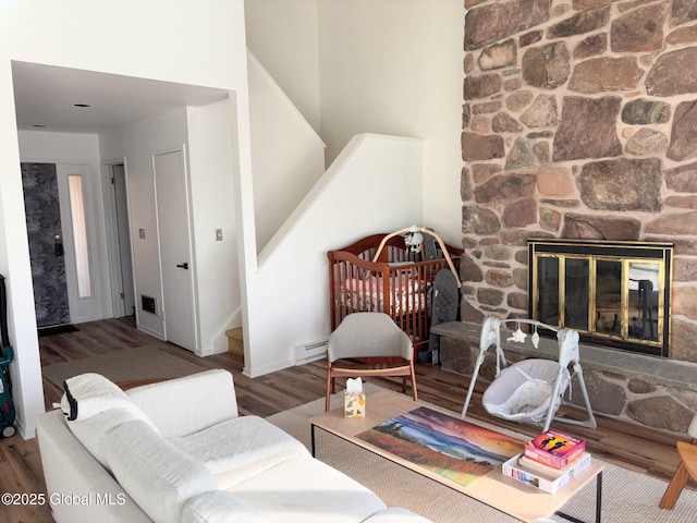 living room with a fireplace and hardwood / wood-style flooring