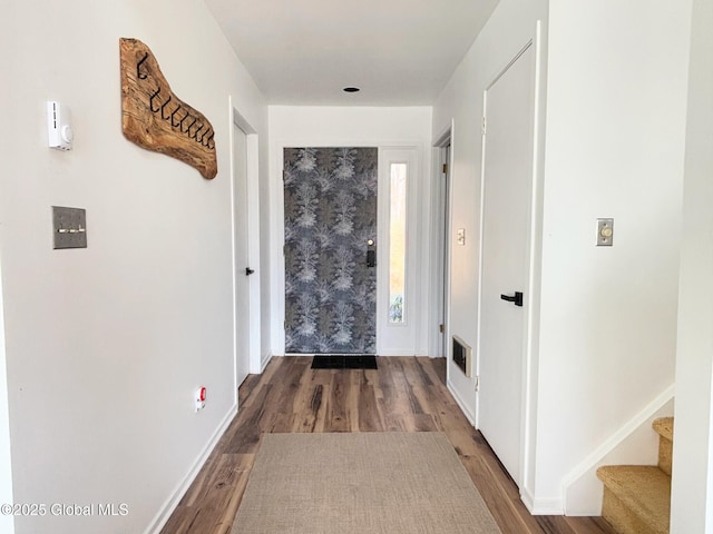 corridor featuring wood-type flooring