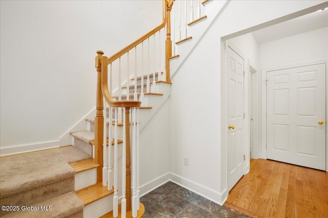 stairs featuring hardwood / wood-style flooring