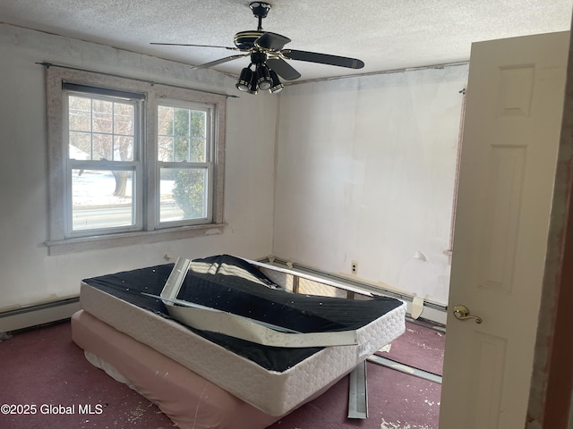 bedroom with ceiling fan, a baseboard radiator, and a textured ceiling