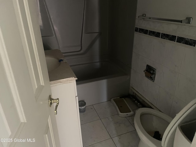 bathroom with tile patterned floors, vanity, and toilet