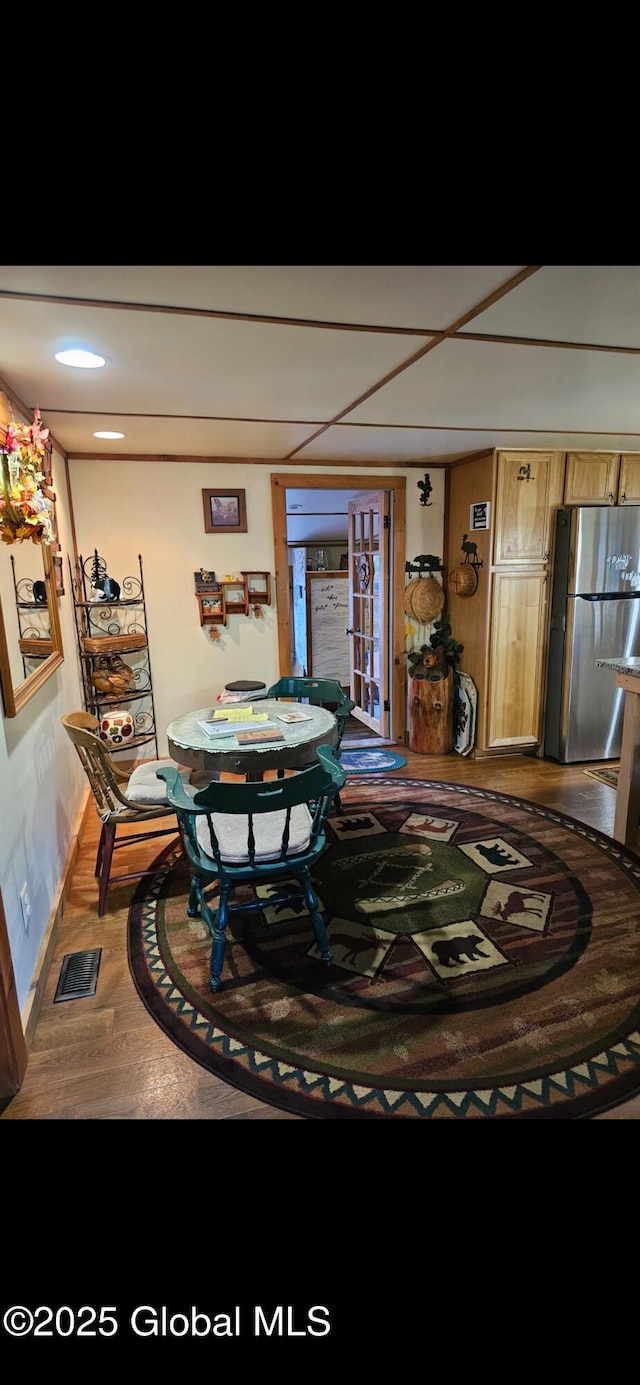 dining area with hardwood / wood-style flooring