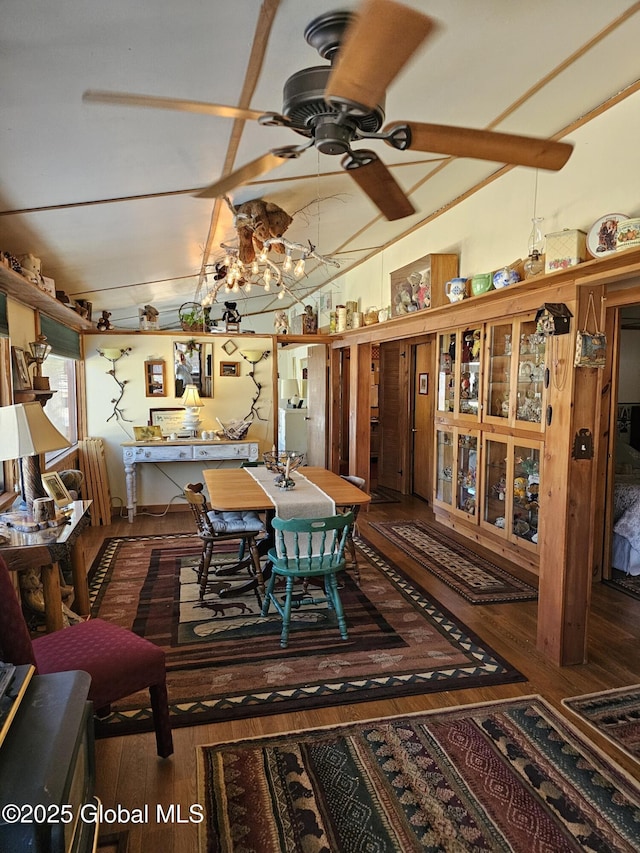 dining space featuring ceiling fan and dark hardwood / wood-style flooring