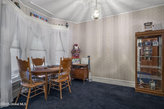 dining area featuring dark carpet and a healthy amount of sunlight