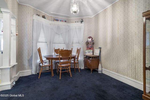 carpeted dining area featuring crown molding