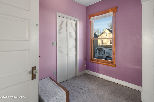 carpeted bedroom featuring a closet