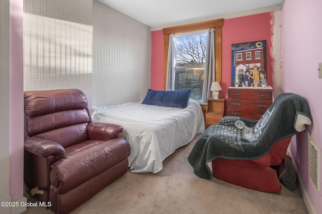 carpeted bedroom featuring crown molding