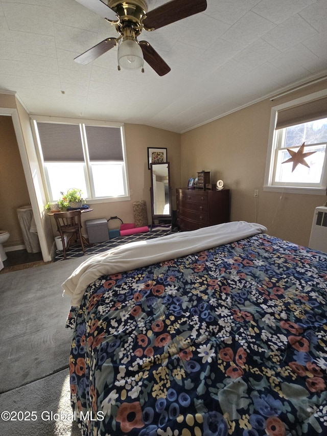 carpeted bedroom with ceiling fan, lofted ceiling, and radiator