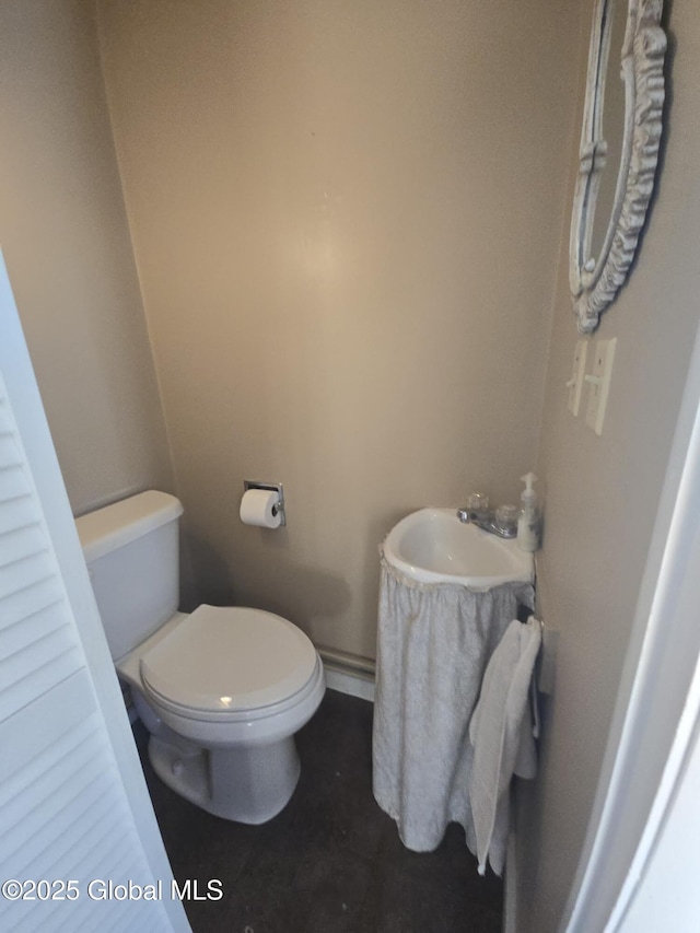 bathroom with toilet and sink