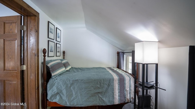 bedroom featuring vaulted ceiling