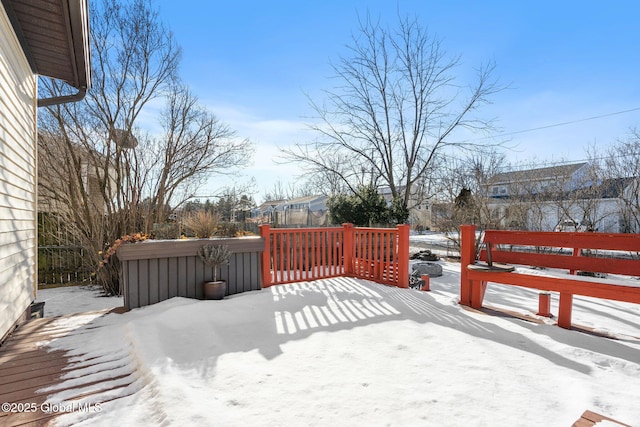 view of snow covered deck