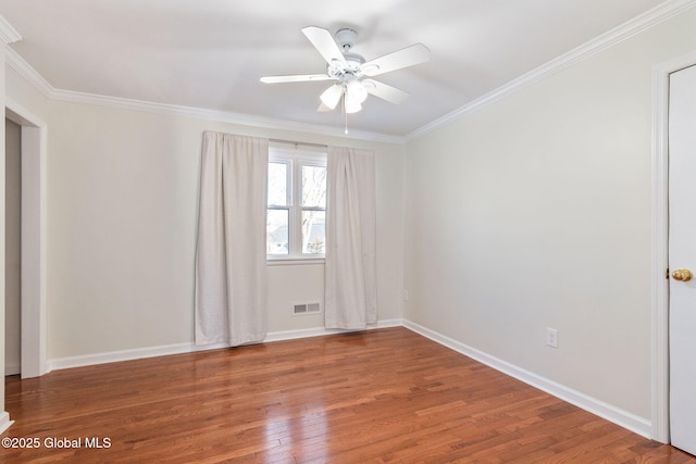 empty room with wood-type flooring, ceiling fan, and crown molding