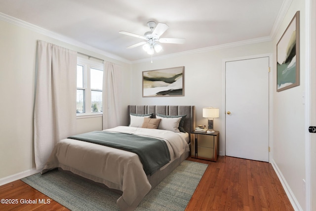 bedroom featuring ceiling fan, ornamental molding, and dark wood-type flooring