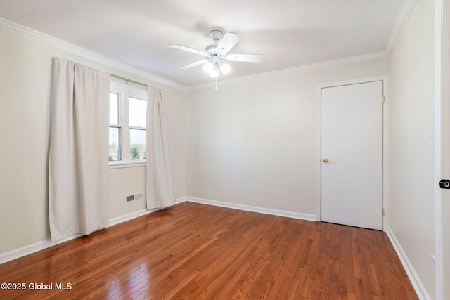 unfurnished room with crown molding, hardwood / wood-style floors, and ceiling fan