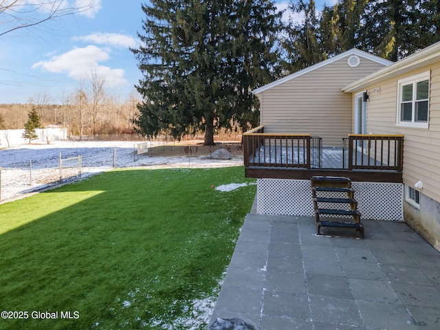 view of yard featuring a patio area and a deck