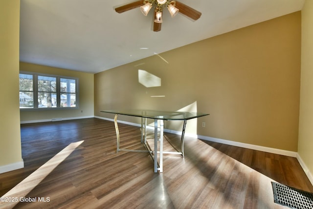 interior space with ceiling fan and dark wood-type flooring