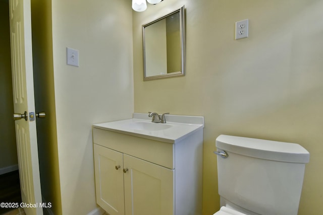 bathroom with toilet and vanity