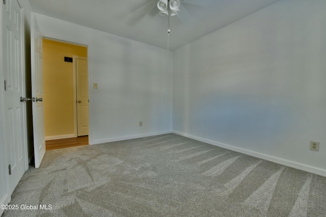 unfurnished room with ceiling fan and light colored carpet