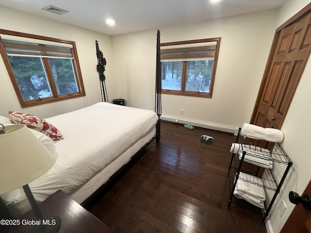 bedroom with a closet and dark wood-type flooring