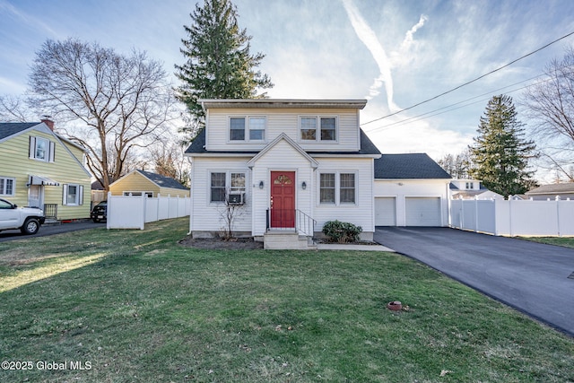 view of front property featuring cooling unit, a front yard, and a garage