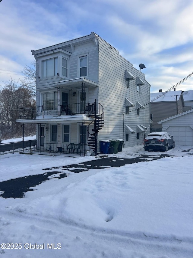 exterior space with a balcony and covered porch